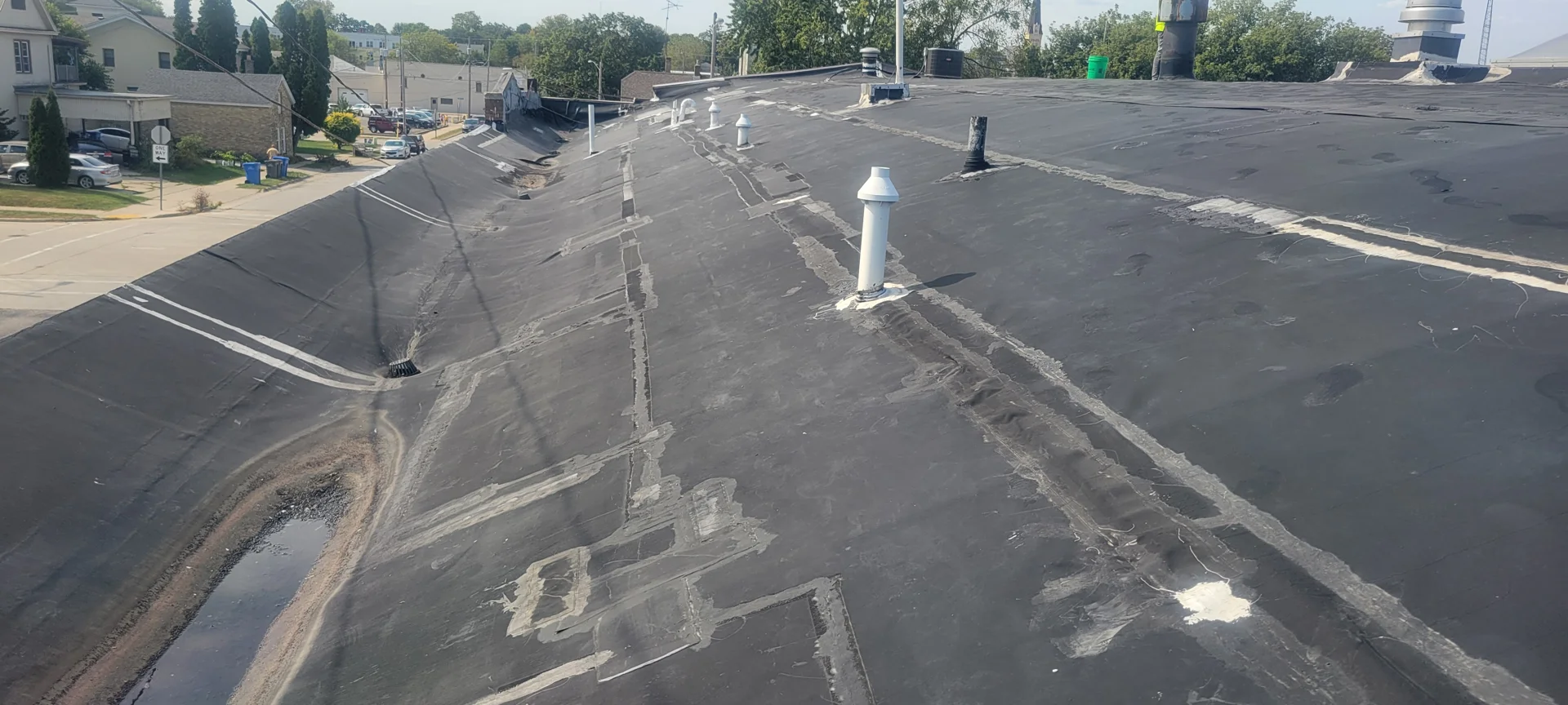 Inspecting commercial roof decking and flashings for active leaks
